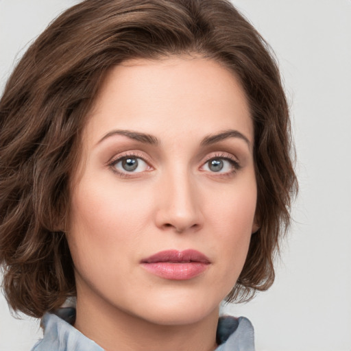 Joyful white young-adult female with medium  brown hair and green eyes