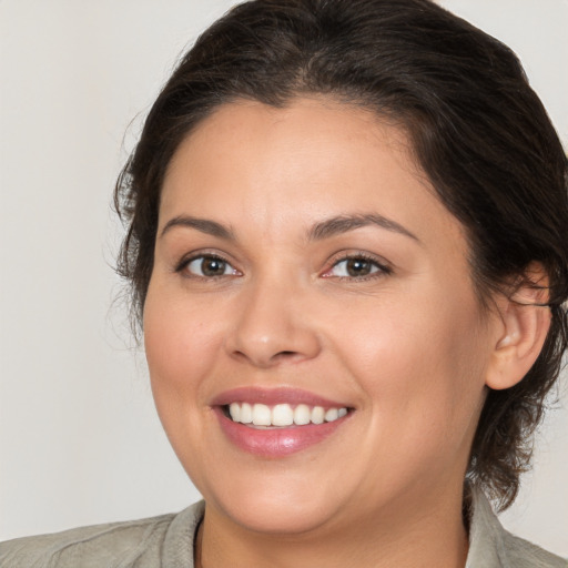 Joyful white young-adult female with medium  brown hair and brown eyes