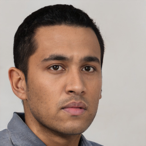 Neutral latino young-adult male with short  black hair and brown eyes