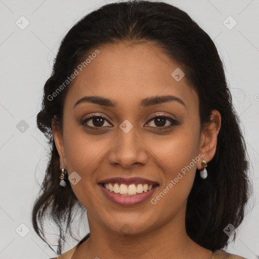 Joyful latino young-adult female with medium  brown hair and brown eyes