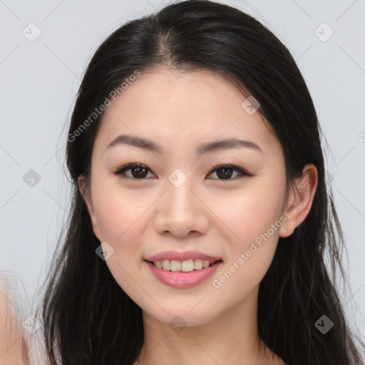 Joyful asian young-adult female with long  brown hair and brown eyes