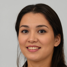 Joyful asian young-adult female with long  brown hair and brown eyes