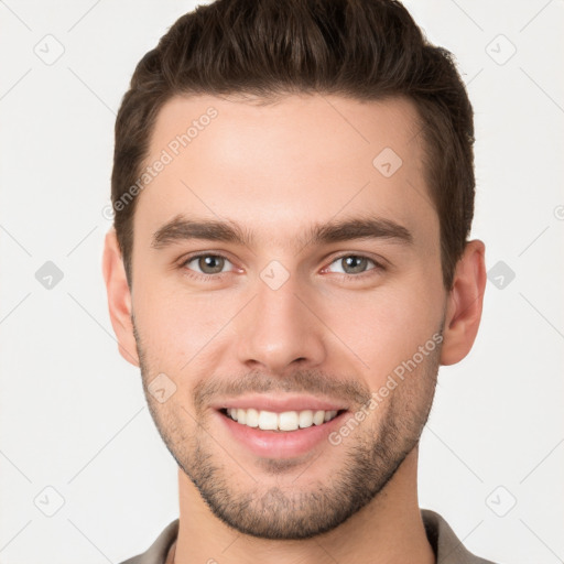 Joyful white young-adult male with short  brown hair and brown eyes