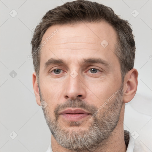 Neutral white adult male with short  brown hair and brown eyes