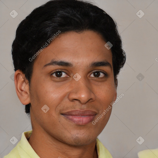 Joyful latino young-adult male with short  brown hair and brown eyes