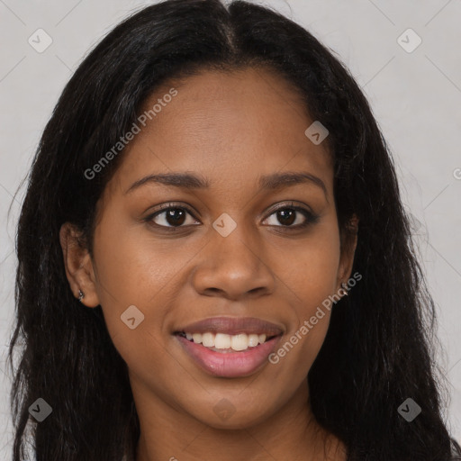 Joyful black young-adult female with long  brown hair and brown eyes