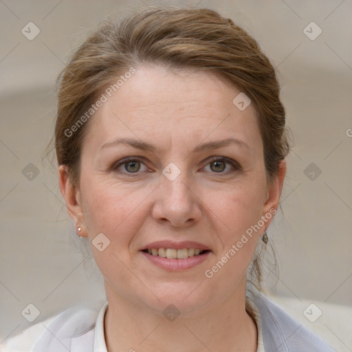 Joyful white adult female with medium  brown hair and grey eyes