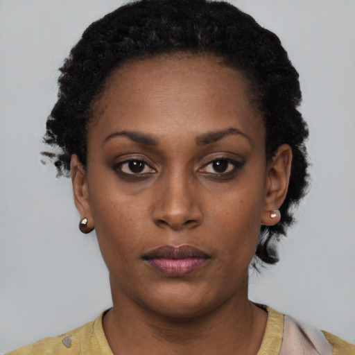 Neutral black young-adult female with short  black hair and brown eyes
