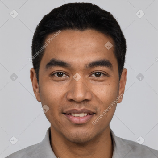 Joyful latino young-adult male with short  black hair and brown eyes