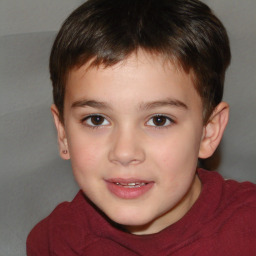 Joyful white child male with short  brown hair and brown eyes