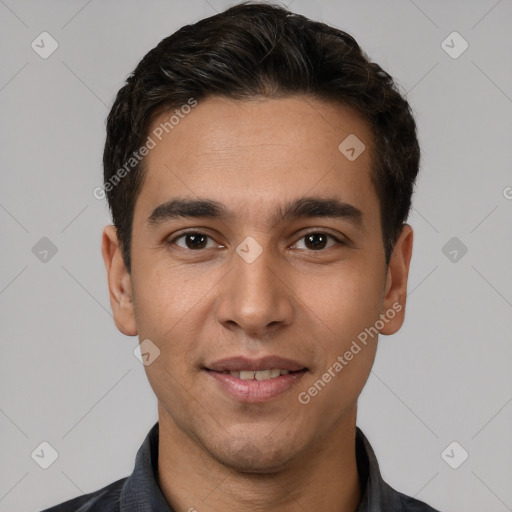 Joyful white young-adult male with short  black hair and brown eyes