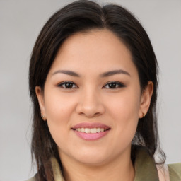 Joyful asian young-adult female with medium  brown hair and brown eyes