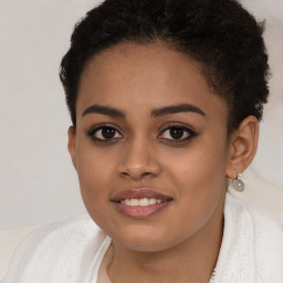 Joyful latino young-adult female with short  brown hair and brown eyes