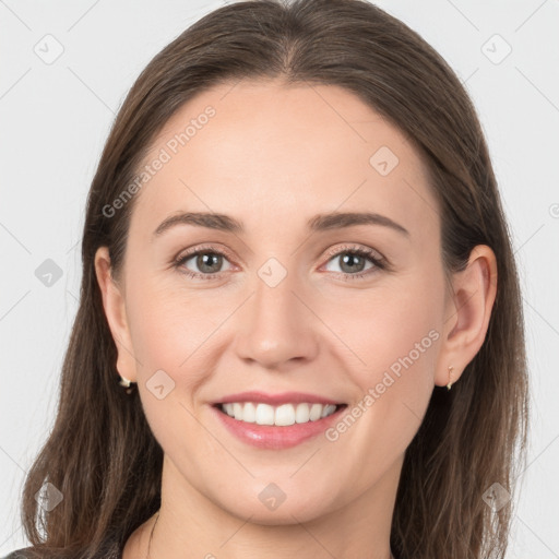 Joyful white young-adult female with medium  brown hair and grey eyes