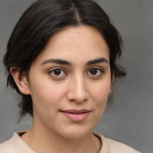 Joyful white young-adult female with medium  brown hair and brown eyes