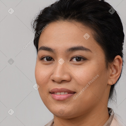 Joyful asian young-adult female with short  brown hair and brown eyes