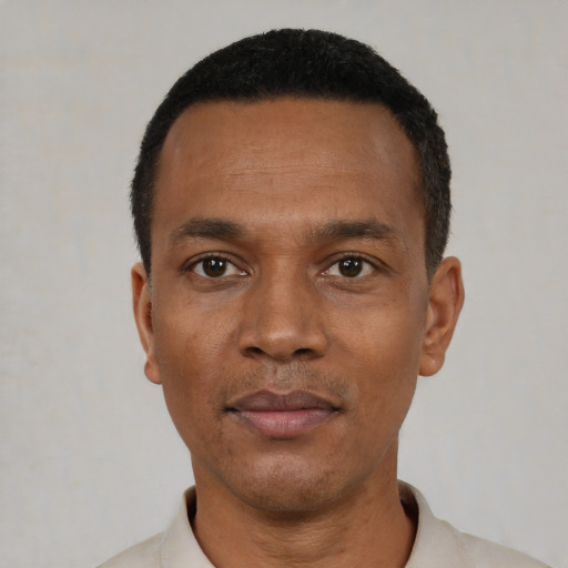 Neutral black adult male with short  black hair and brown eyes