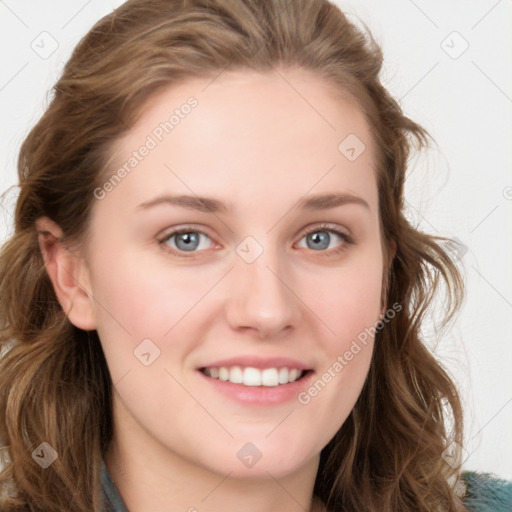 Joyful white young-adult female with long  brown hair and blue eyes