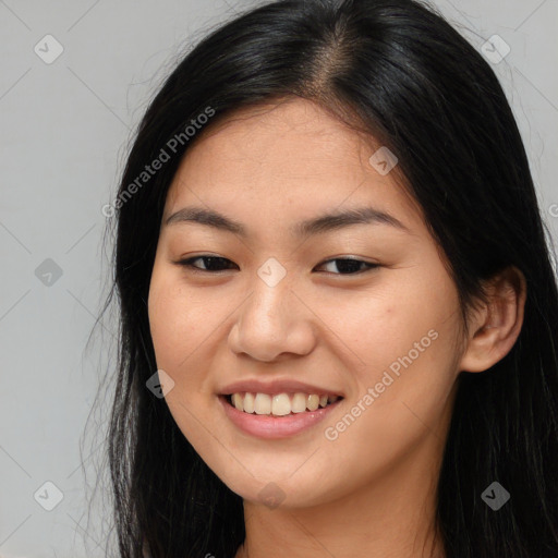 Joyful asian young-adult female with long  brown hair and brown eyes