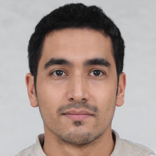 Neutral latino young-adult male with short  black hair and brown eyes