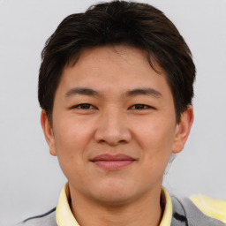 Joyful asian young-adult male with short  brown hair and brown eyes