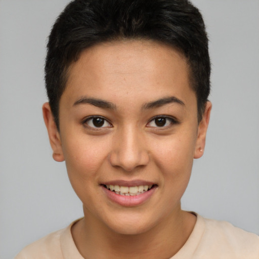 Joyful latino young-adult female with short  brown hair and brown eyes