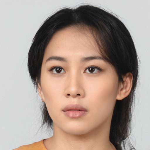 Neutral asian young-adult female with medium  brown hair and brown eyes