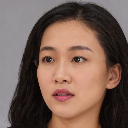 Neutral asian young-adult female with long  brown hair and brown eyes
