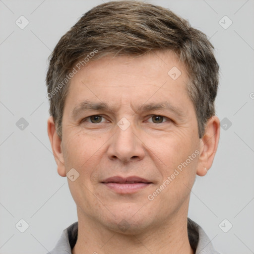 Joyful white adult male with short  brown hair and grey eyes