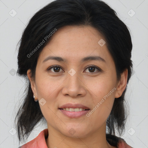 Joyful latino young-adult female with medium  brown hair and brown eyes