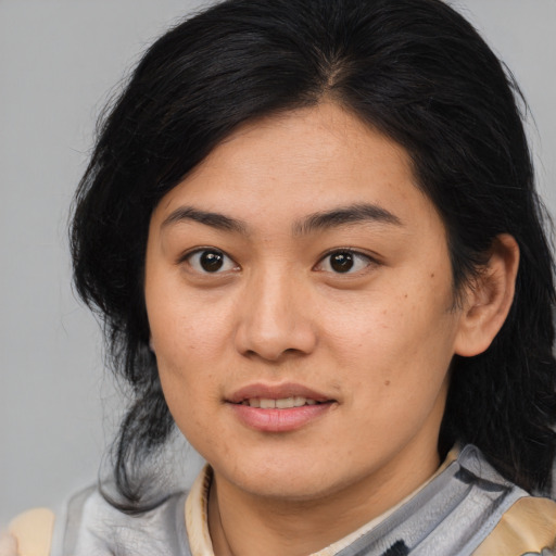 Joyful asian young-adult female with medium  brown hair and brown eyes