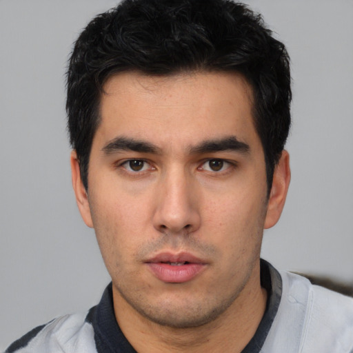 Neutral white young-adult male with short  black hair and brown eyes