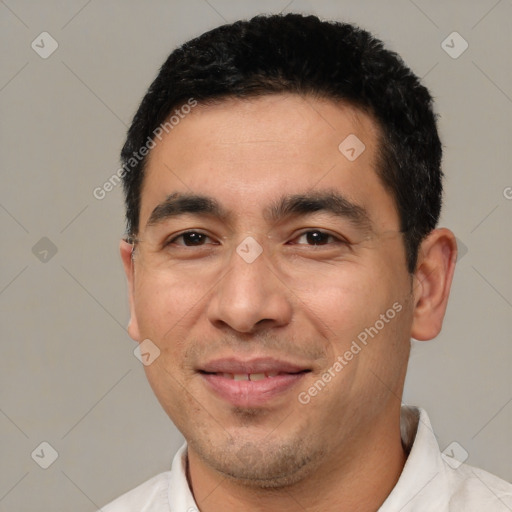 Joyful white adult male with short  black hair and brown eyes