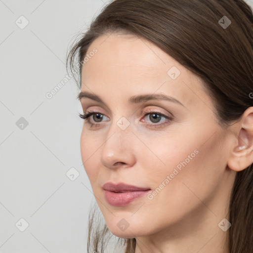 Neutral white young-adult female with long  brown hair and brown eyes