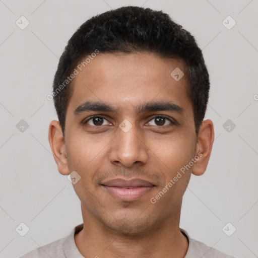 Joyful latino young-adult male with short  black hair and brown eyes