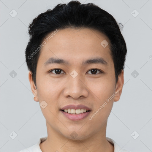 Joyful asian young-adult male with short  black hair and brown eyes