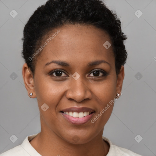 Joyful black young-adult female with short  brown hair and brown eyes