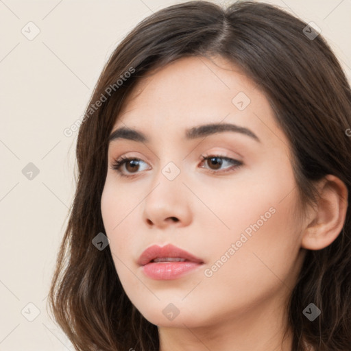 Neutral white young-adult female with long  brown hair and brown eyes