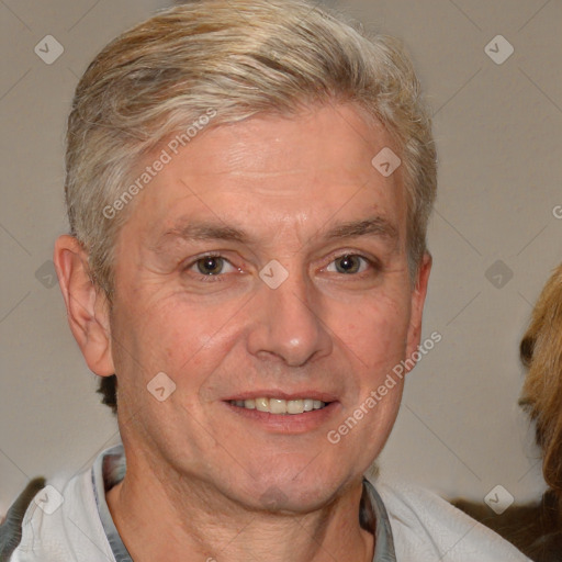 Joyful white middle-aged male with short  brown hair and brown eyes