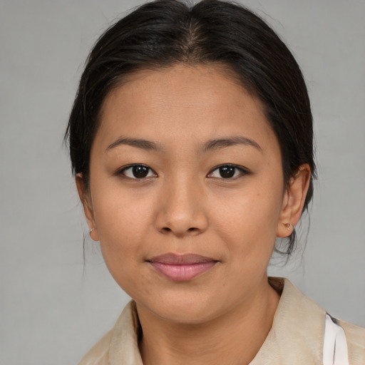 Joyful asian young-adult female with medium  brown hair and brown eyes