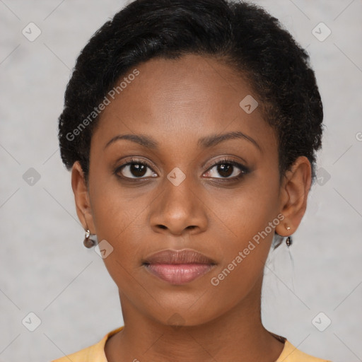 Joyful black young-adult female with short  brown hair and brown eyes