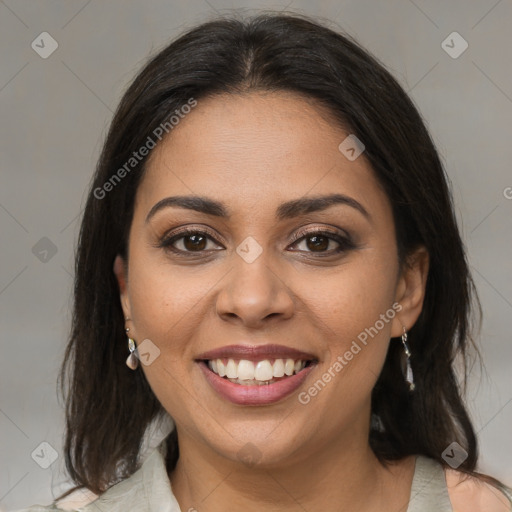 Joyful latino young-adult female with medium  brown hair and brown eyes