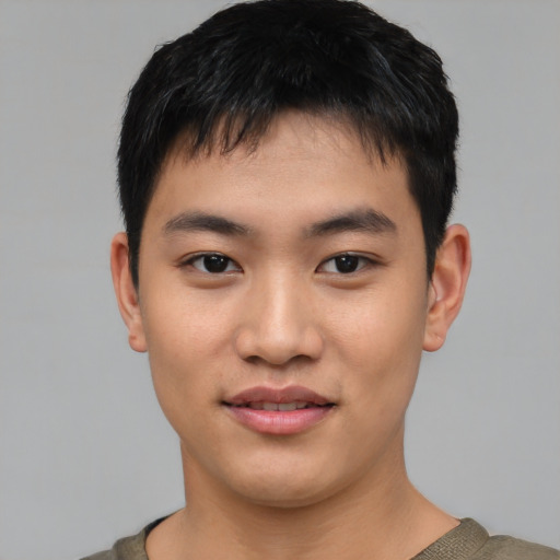Joyful asian young-adult male with short  black hair and brown eyes