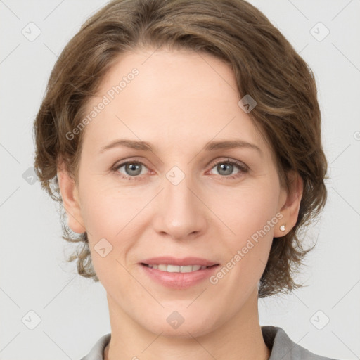 Joyful white adult female with medium  brown hair and grey eyes