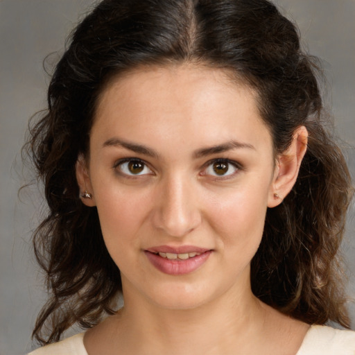 Joyful white young-adult female with medium  brown hair and brown eyes