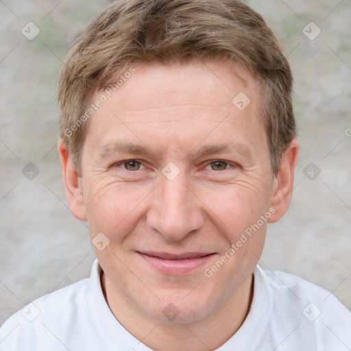 Joyful white adult male with short  brown hair and grey eyes