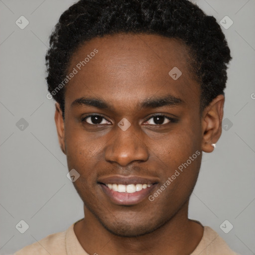 Joyful black young-adult male with short  brown hair and brown eyes