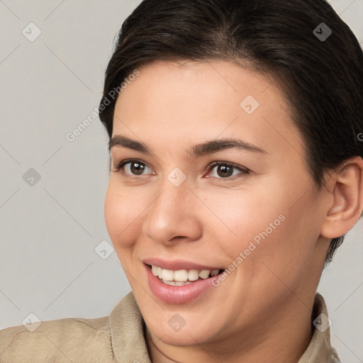 Joyful white young-adult female with short  brown hair and brown eyes