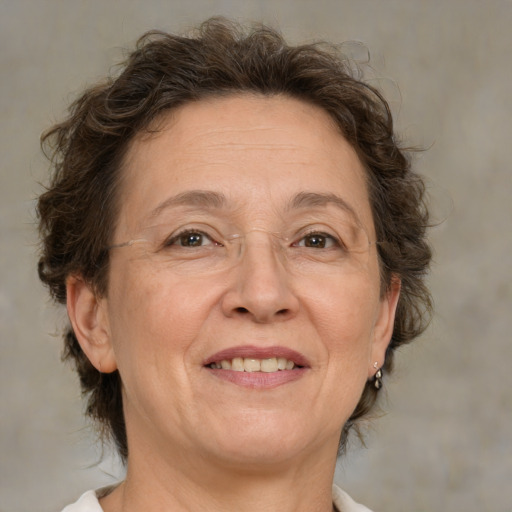 Joyful white middle-aged female with medium  brown hair and brown eyes