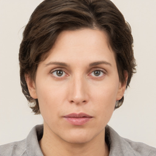 Neutral white young-adult female with short  brown hair and brown eyes